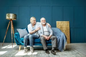 Senior couple on the couch at home